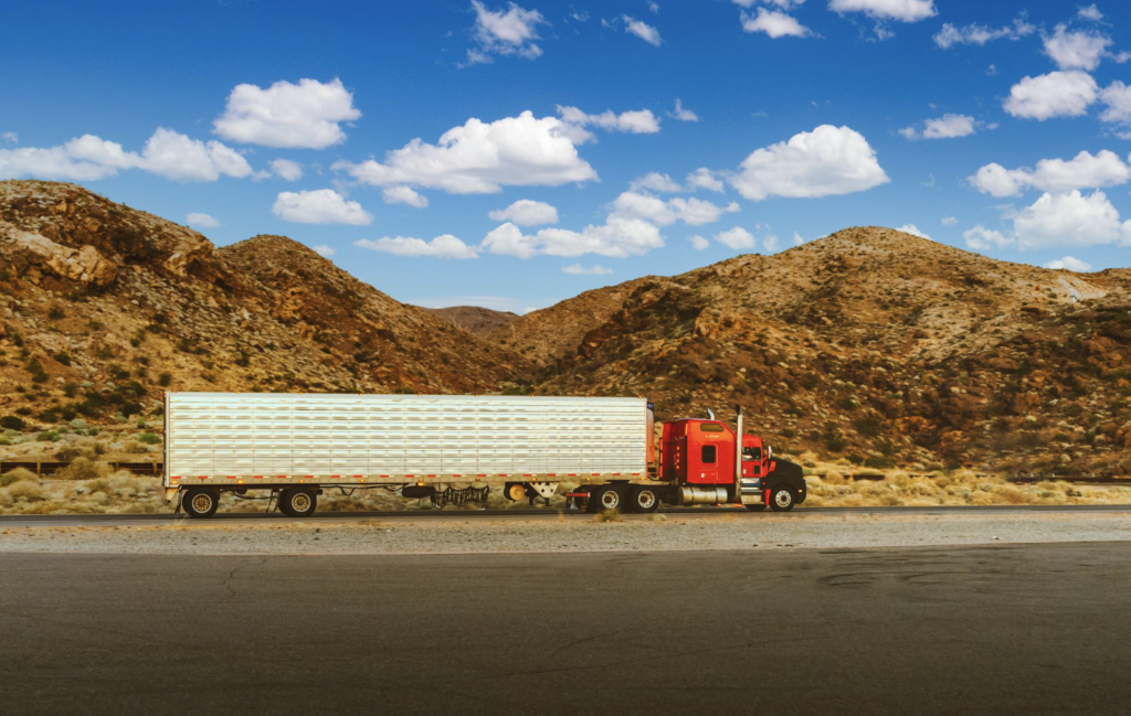 semi-truck in front of mountains